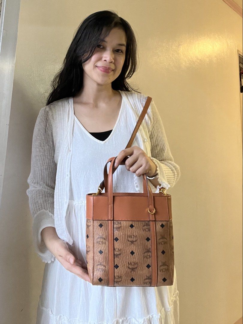 MCM mini aren bag (Category: Luxury Bags & Wallets) located in Caloocan City. Submitted by mahanne (Listing ID 1458509724, Image 1). Description: MCM Cognac Visetos Tote / Shoulder Bag – Beautiful Condition Authentic- MCM monogram tote bag in a classic cognac/caramel brown colorway. Features the iconic MCM Visetos monogram pattern with black diamond motifs, complemented by smooth leather trim and gold-tone hardware. ✨ Details: * Classic MCM monog