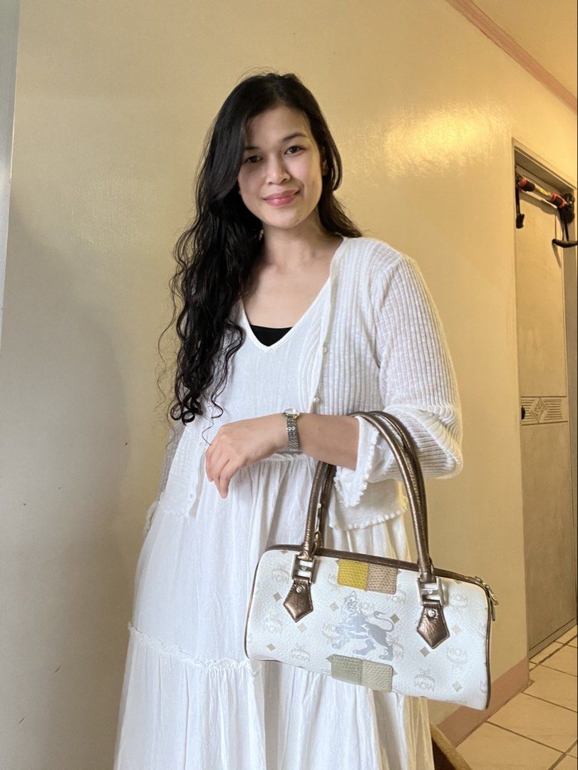 MCM Monogram Barrel Bag White Brown (Category: Luxury Bags & Wallets) located in Caloocan City. Submitted by mahanne (Listing ID 1458510096, Image 1). Description: - Authentic MCM barrel bag - Signature monogram print - Brown leather handles and trim - Secure zipper closure - Interior zippered pocket - Unique patchwork side details - Minor interior and exterior marks consistent with normal use - Compact and stylish design.