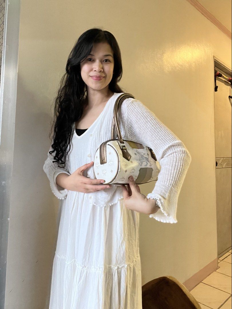 MCM Monogram Barrel Bag White Brown (Category: Luxury Bags & Wallets) located in Caloocan City. Submitted by mahanne (Listing ID 1458510096, Image 2). Description: - Authentic MCM barrel bag - Signature monogram print - Brown leather handles and trim - Secure zipper closure - Interior zippered pocket - Unique patchwork side details - Minor interior and exterior marks consistent with normal use - Compact and stylish design.