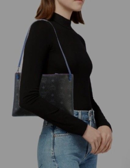 MCM Monogram Wrislet Clutch ,Pochette (Category: Luxury Bags & Wallets) located in Navotas City. Submitted by ms.soulana (Listing ID 1462874450, Image 2). Description: PREOWNED WellUsed Authentic MCM c Monogram leather Wrislet /Clutch /Kili bag blue black XS - Classic black with signature blue monogram pattern - Stylish blue leather trim and strap - Secure z YKK Zipper closure - Interior card slots for organization - Detachable wrist strap includ