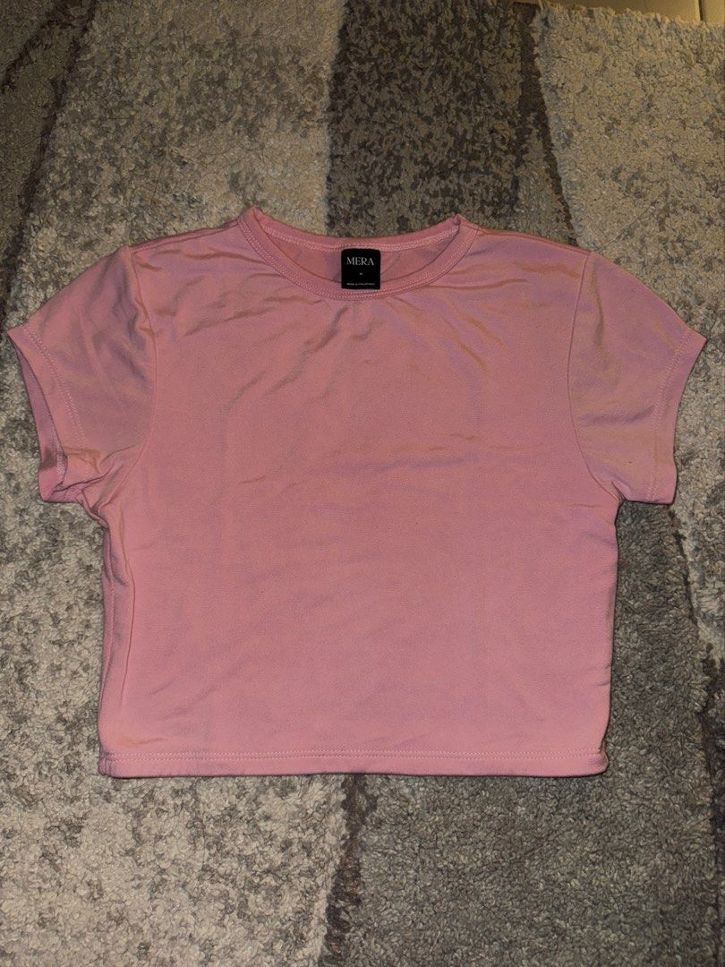 MERA Crop Top [Lila] (Category: Shirts) located in Cebu City. Submitted by cholinesterase (Listing ID 1462860921, Image 1). Description: - Pink cropped t-shirt from MERA - Short sleeves and crew neck - Soft and stretchy material - Ideal for casual wear or layering - Pairs well with jeans or shorts.