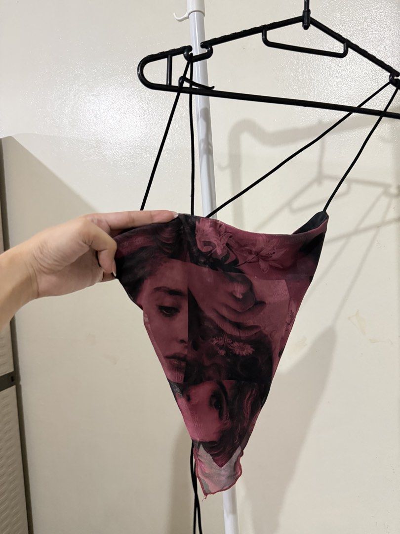 Mesh Halter Top with Portrait Print (Category: Blouses) located in Manila. Submitted by lovedbyan (Listing ID 1462878271, Image 1). Description: -XS-S - Sheer mesh halter top - Unique portrait and floral print in deep red and black - Adjustable tie-back closure - Lightweight and airy fabric - Versatile for layering or as a statement piece.