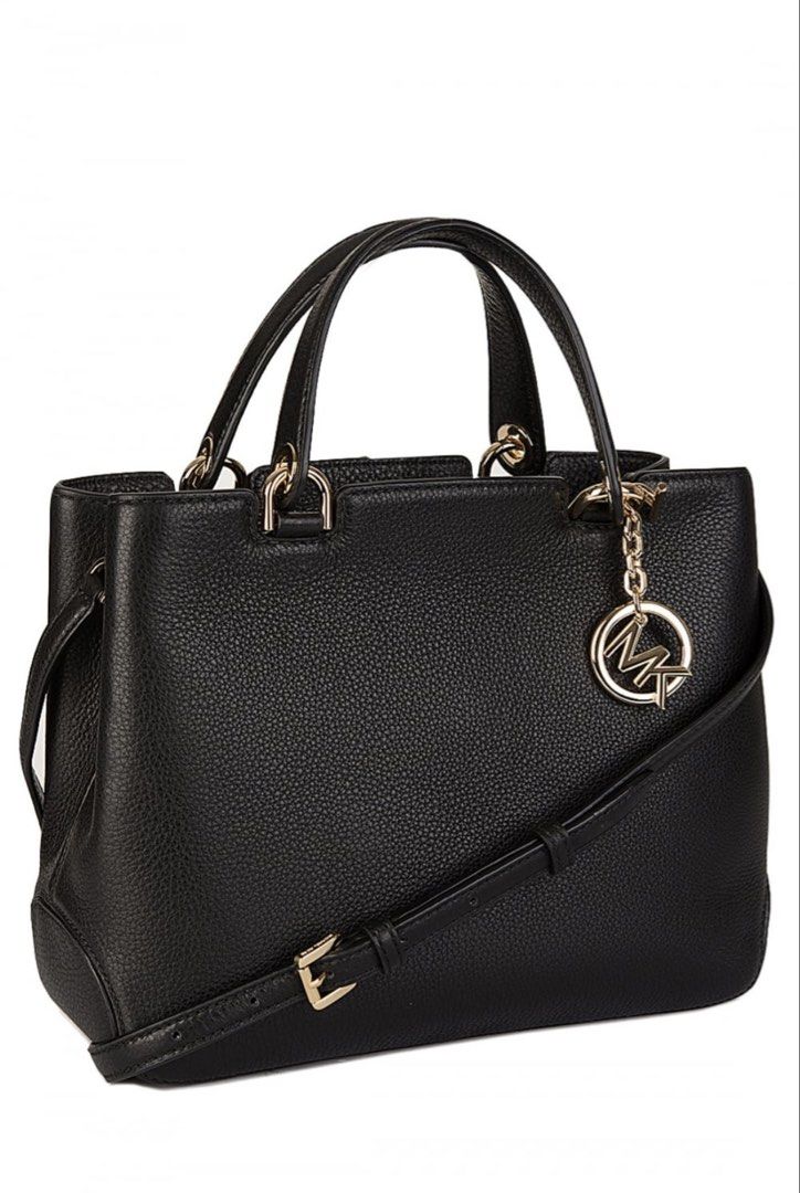 Michael Kors Anabelle crossbody bag (Category: Luxury Bags & Wallets) located in Manila. Submitted by kimscorner (Listing ID 1462712261, Image 2). Description: ✓ Michael Kors Anabell crossbody bag featuring a distinctive gold-tone MK logo hanging charm. ✓ This is 100% original Michael Kors bag bought directly in the USA. ✓ This is a preloved item. ✓ Original but slight sign of usage but not abused. ✓ Excellent condition. ✓ More actual pictures up