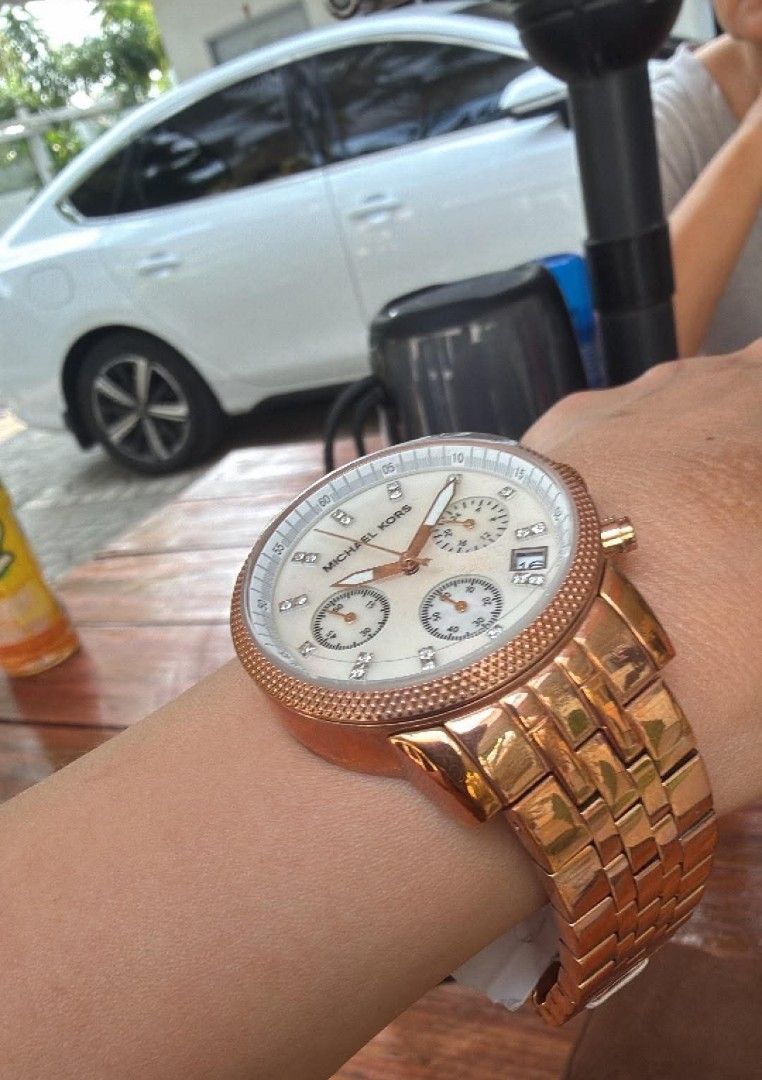 Michael Kors Gold-Tone Ritz Watch (Category: Luxury Watches) located in Quezon City. Submitted by flat.earther23 (Listing ID 1462753814, Image 2). Description: - Rose Gold Michael Kors Watch - Stunning Mother of Pearl Dial - Diamond Hour Markers - Functional Chronograph with 3 Sub-dials - Convenient Date Window at 4 o'clock - Durable Rose Gold Stainless Steel Bracelet - Comes with Original Michael Kors Box https://www.google.com/search?q=Michael%