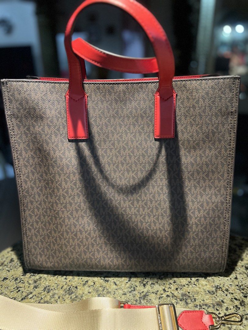 Michael Kors Kenly Tote Bag with Shoulder Strap (Category: Luxury Bags & Wallets) located in Manila. Submitted by kathlv (Listing ID 1462852549, Image 2). Description: - Original Michael Kors Tote Bag - Classic brown signature MK pattern with stylish red accents - Features comfortable top handles - Includes a detachable shoulder strap for versatile carrying - Interior zip pocket and slip pocket for organization - Comes with original tags, care ca