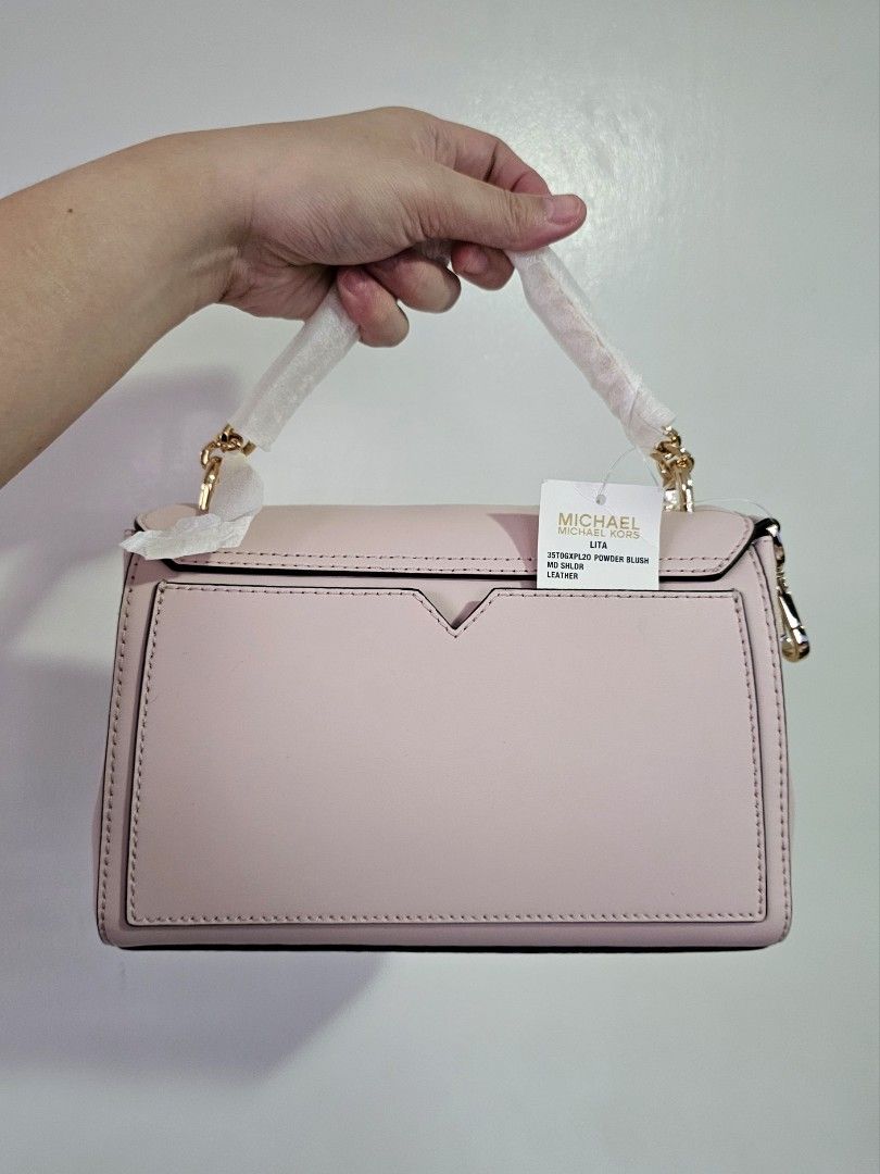 Michael Kors Lita Powder Blush (Category: Luxury Bags & Wallets) located in Quezon City. Submitted by prettyluvbags (Listing ID 1462757470, Image 3). Description: Michael Kors Lita medium in Powder Blush brand new 100% original two way (chain handbag, leather strap) so pretty color & roomy bag has a very minimal storage flaw (dots) selling low for only 4500+sf (lowered from 6800 price) no to low ballers. Steal deal!.