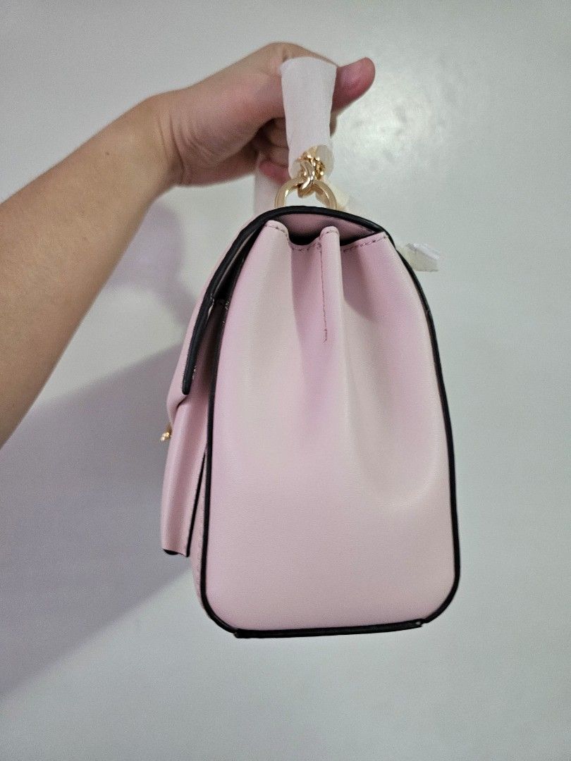 Michael Kors Lita Powder Blush (Category: Luxury Bags & Wallets) located in Quezon City. Submitted by prettyluvbags (Listing ID 1462757470, Image 2). Description: Michael Kors Lita medium in Powder Blush brand new 100% original two way (chain handbag, leather strap) so pretty color & roomy bag has a very minimal storage flaw (dots) selling low for only 4500+sf (lowered from 6800 price) no to low ballers. Steal deal!.