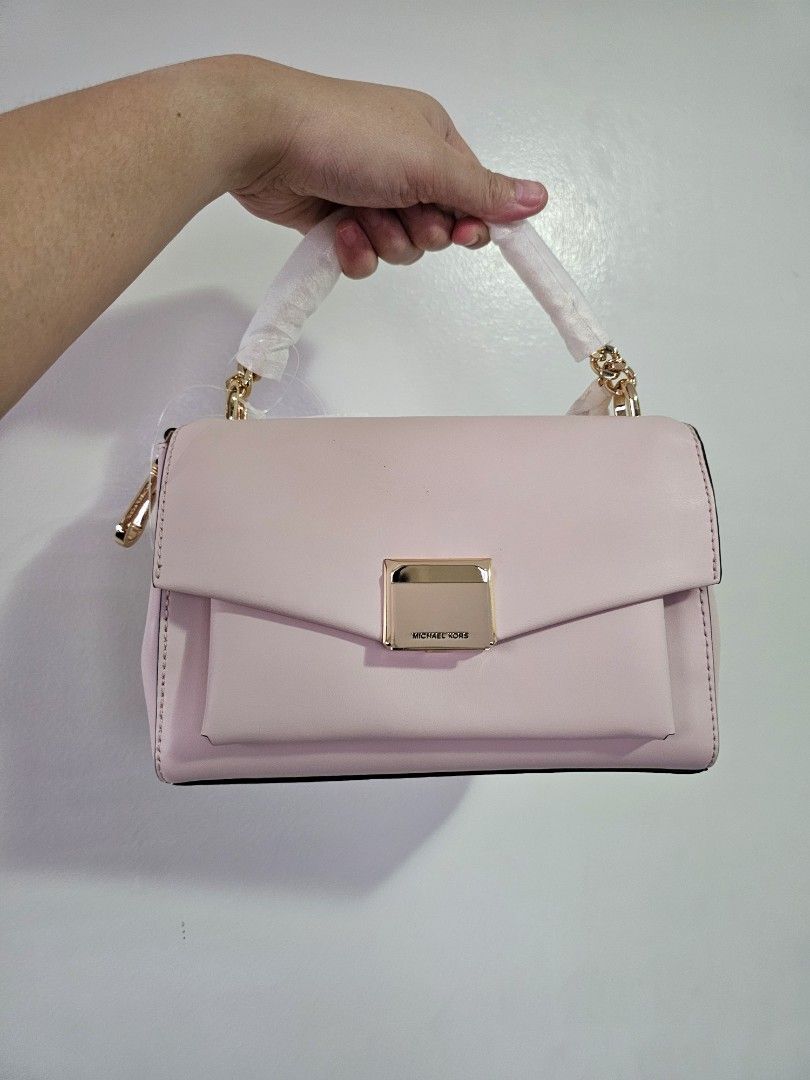 Michael Kors Lita Powder Blush (Category: Luxury Bags & Wallets) located in Quezon City. Submitted by prettyluvbags (Listing ID 1462757470, Image 1). Description: Michael Kors Lita medium in Powder Blush brand new 100% original two way (chain handbag, leather strap) so pretty color & roomy bag has a very minimal storage flaw (dots) selling low for only 4500+sf (lowered from 6800 price) no to low ballers. Steal deal!.