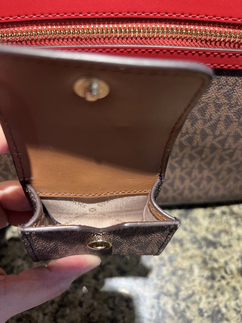 Michael Kors Monogram Coin Pouch Keychain/Earpods case (Category: Luxury Bags & Wallets) located in Manila. Submitted by kathlv (Listing ID 1462845049, Image 3). Description: - Original Michael Kors coin pouch/earpods case - Features iconic MK monogram print - Chic brown and tan colorway - Secure snap closure - Convenient keychain attachment - Gold-tone hardware accents - Perfect for coins/earpods.