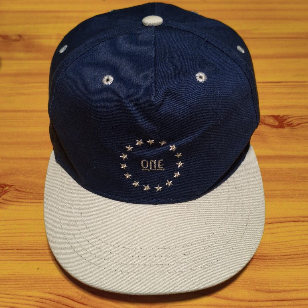 Miniso Japan Navy Blue & Beige Snapback Cap (Category: Caps & Hats) located in Manila. Submitted by caps08 (Listing ID 1462875450, Image 2). Description: - Navy blue cap with a stylish beige brim. - Unique circular embroidery featuring stars and 'ONE' in the center. - Adjustable strap at the back for a comfortable, customized fit. - Authentic Miniso Life branding inside. - Ideal for adding a cool, casual vibe to any outfit..