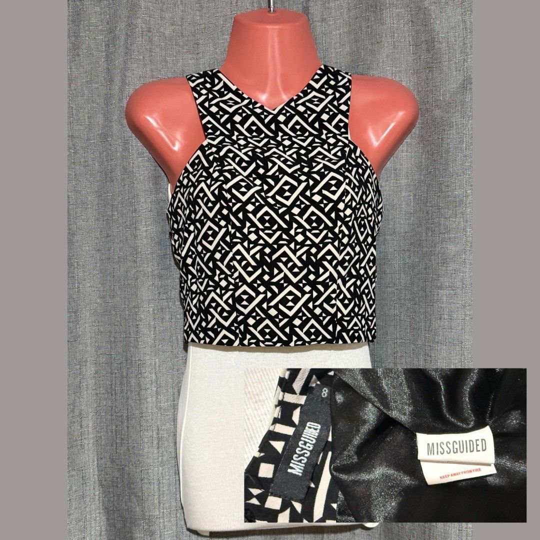 MISSGUIDED Geometric Cross-Front Crop Top 🖤🤍 (Category: Sleeveless) located in Marikina City. Submitted by styledandsassified (Listing ID 1462768790, Image 1). Description: Brand: Missguided Details: Criss-cross halter neckline, full back zip closure, fully lined, structured fitted crop. Pattern/Color: Black & White Geometric / Tribal Print Size: UK 8 / US 4 / EU 36 / AUS 8 Reminders: Pls manage expectations as this is a thrifted item. Mannequi