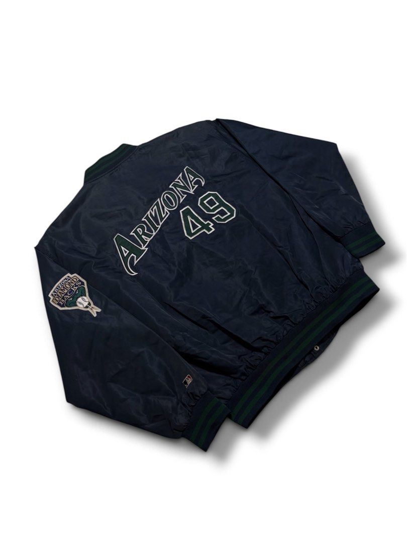 MLB Arizona Varsity Jacket (Category: Coats, Jackets and Outerwear) located in Cabuyao City. Submitted by 0ld_souls (Listing ID 1462864982, Image 1). Description: - Cool Arizona Diamondbacks bomber jacket - Team logo prominently displayed on front and back - Features number 49 on the back - MLB and F&F tags visible - Ribbed collar, cuffs, and hem for a comfortable fit - Classic snap button closure.