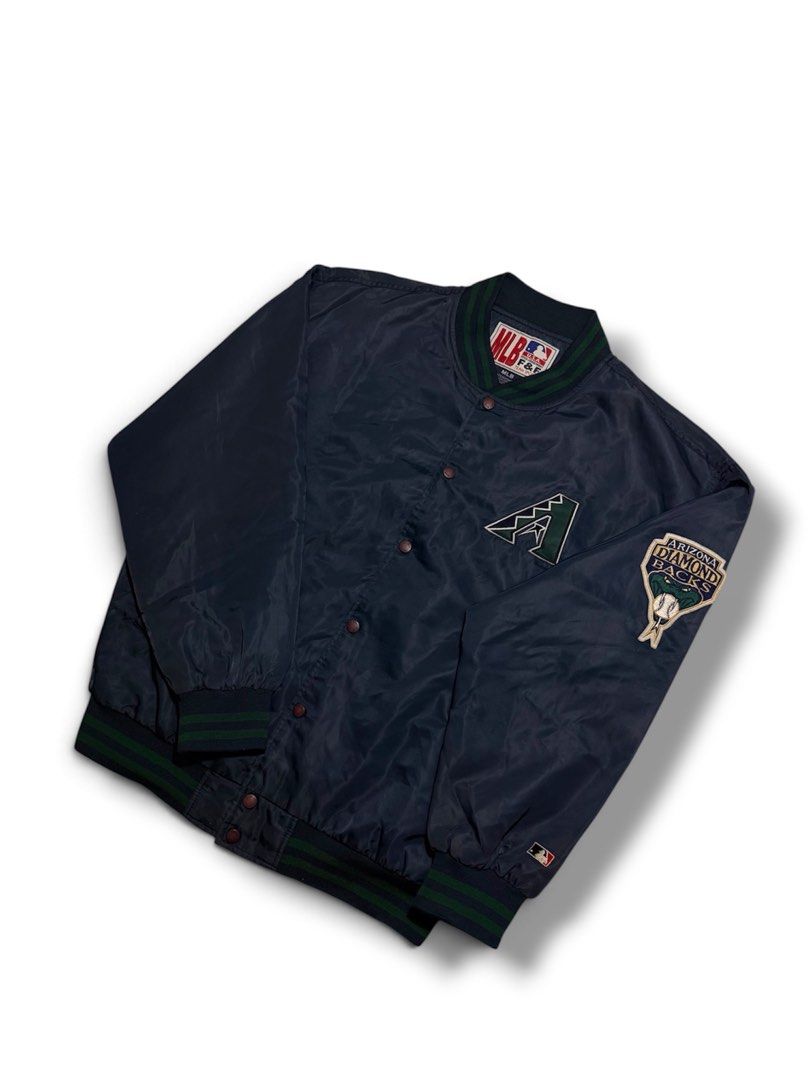 MLB Arizona Varsity Jacket (Category: Coats, Jackets and Outerwear) located in Cabuyao City. Submitted by 0ld_souls (Listing ID 1462864982, Image 2). Description: - Cool Arizona Diamondbacks bomber jacket - Team logo prominently displayed on front and back - Features number 49 on the back - MLB and F&F tags visible - Ribbed collar, cuffs, and hem for a comfortable fit - Classic snap button closure.