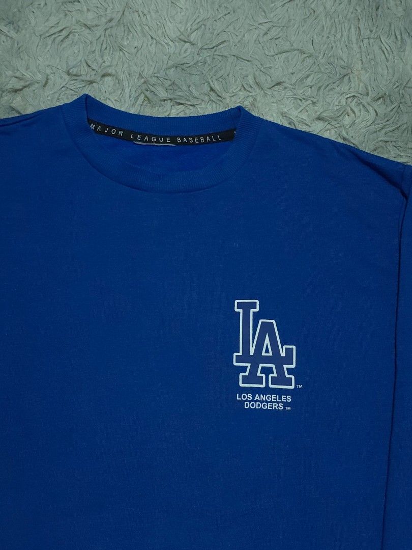 MLB LA DODGERS (Category: Formal Shirts) located in Abulug. Submitted by humanwhosellthings (Listing ID 1462719384, Image 3). Description: MLB LA DODGERS ✅️Size: Small - Medium ✅️Dimes: 19W x 24.5L ✅Condition: Excellent ✅Issue: Cut maintag only, design po yung parang cracks sa print👌 ✅Color Rate: 9.5/10.