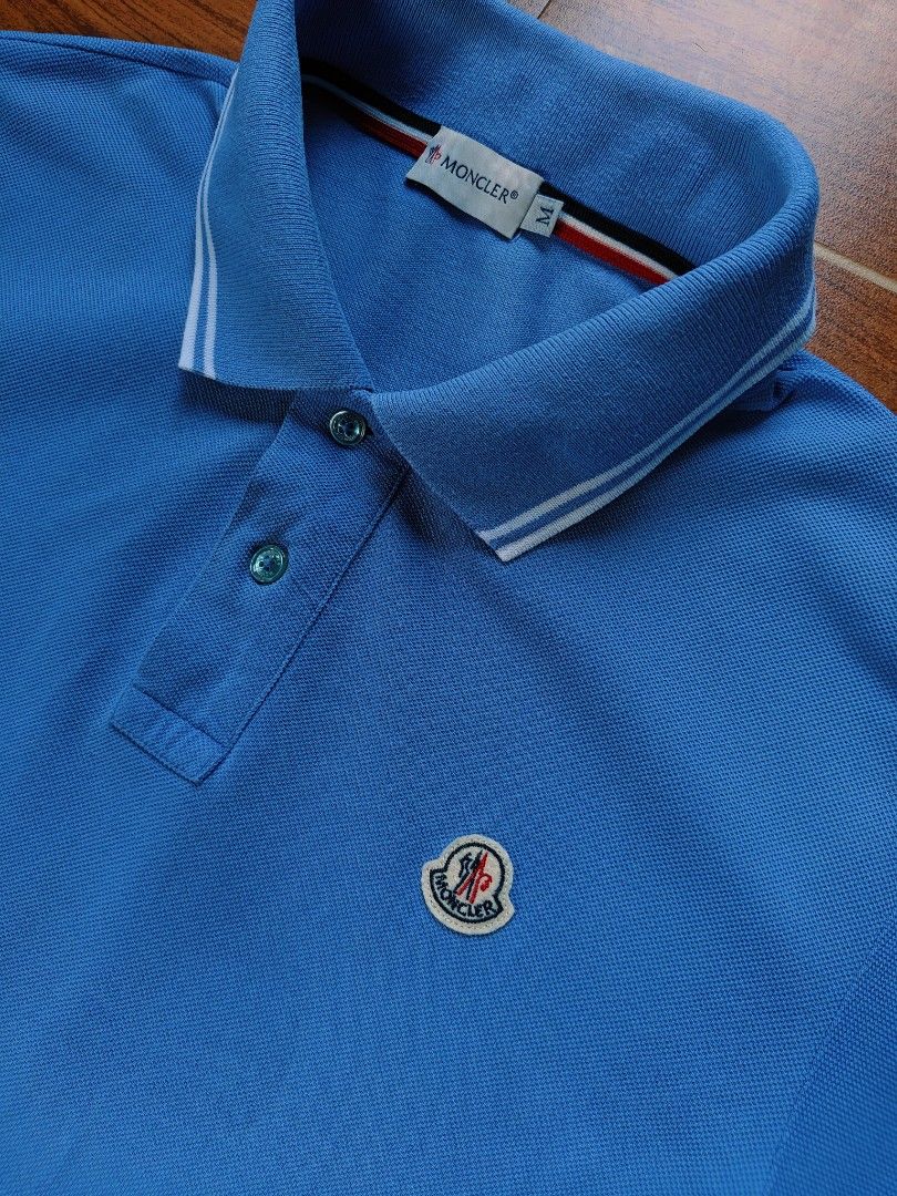Moncler Polo Small Logo Patch Striped Collar&Sleeve (Light Blue) (Category: Tshirts & Polo Shirts ) located in Davao. Submitted by raymnd89 (Listing ID 1462818475, Image 3). Description: Moncler Polo Small Logo Patch Striped Collar&Sleeve (Light Blue) S: Medium on tag, can fit Medium to semi Large L: 28 W: 19.5 Color rate: 10/10 Excellent condition Issue: cut wash tag only.