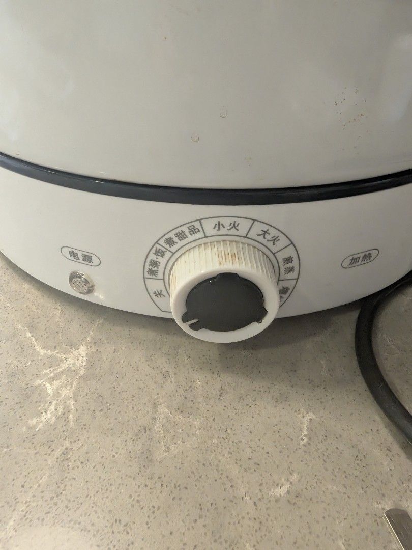Multi-function Electric Pot Steamer (Category: Cookers) located in Singapore. Submitted by 2fufu (Listing ID 1462765989, Image 3). Description: - Multi-function electric pot (Model YS-55L) - Powerful 1350W, 220V operation - Ideal for steaming and cooking a variety of dishes - Features a non-stick interior for easy cleaning - Control knob with multiple heat settings for versatile cooking - Comes complete with a steamer tray, lid, and power cord.