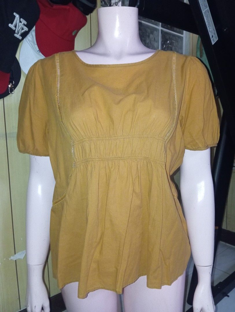 Mustard Yellow Puff Sleeve Peplum Top (Category: Blouses) located in Cebu City. Submitted by smnthdanielle (Listing ID 1462882649, Image 2). Description: - Adorable mustard yellow top - Features stylish puff sleeves - Flattering peplum cut - Subtle textured detail on the neckline - Perfect for dressing up or down - Easily pairs with skirts or pants - Made with comfortable fabric.