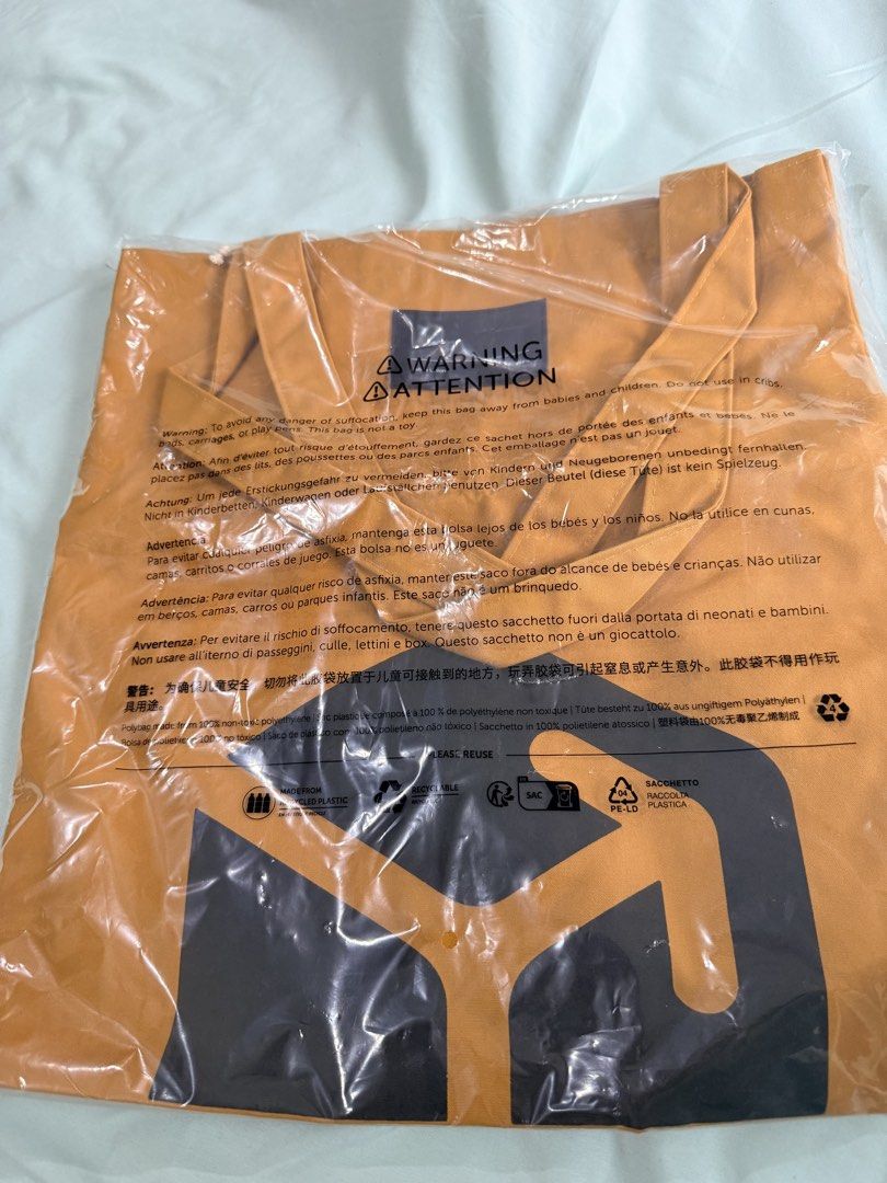 Native Union Tote Bag - Orange (Category: Tote Bags) located in Manila. Submitted by purplebunnie1 (Listing ID 1462768476, Image 2). Description: - Brand: Native Union - Color: Orange - Features: Brand logo on front - Condition: Comes in original packaging - Use: Great for carrying everyday essentials - Design: Simple and functional.