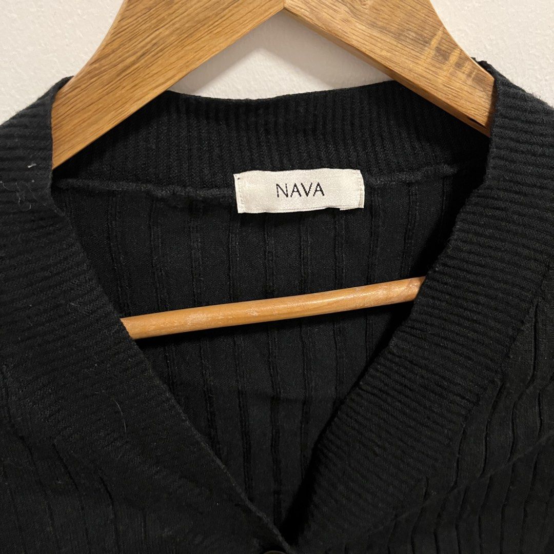 NAVA Black Ribbed Cropped Cardigan (Category: Coats, Jackets and Outerwear) located in Las Pinas. Submitted by thevallerys (Listing ID 1462824094, Image 2). Description: - Brand: NAVA - Style: Black ribbed cropped cardigan - Neckline: V-neck - Closure: Button front - Sleeves: Long sleeves with flared cuffs - Versatility: Great for layering or wearing alone - Styling: Easily pairs with jeans or skirts.