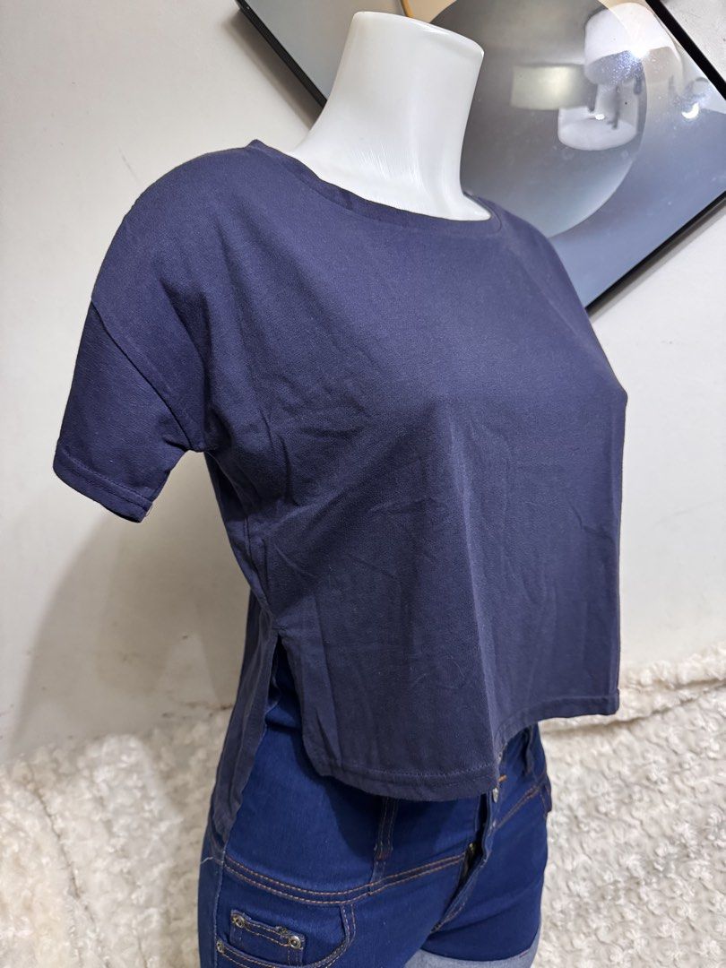 Navy Blue Cropped T-shirt (Category: Shirts) located in Marikina City. Submitted by lorradel (Listing ID 1462705380, Image 2). Description: - fits S-M - Navy blue cropped t-shirt - Short sleeves, relaxed fit - Boat neckline - Side slits for added detail - Comfortable fabric - Pairs perfectly with high-waisted bottoms - MAY HAVE some washable stains (hindi maiiwasan) needs washing; had been stored - mannequin size 34-26-34 - mannequin’s shoulder t
