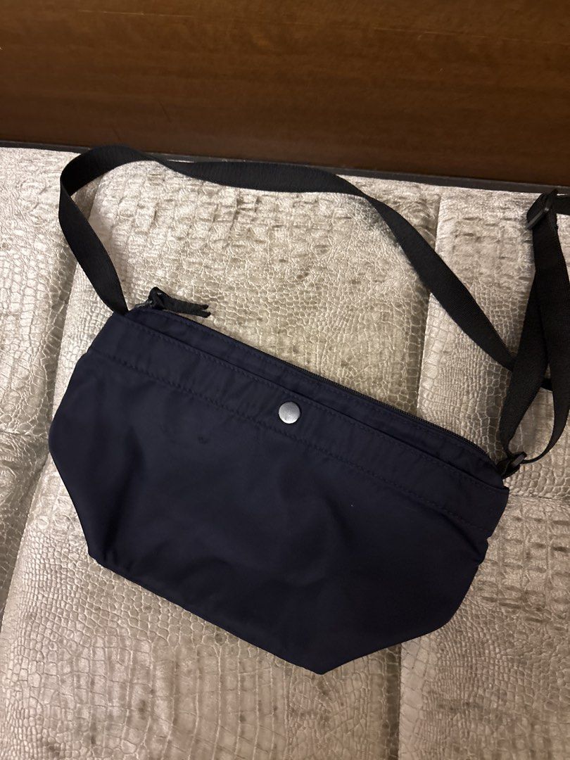 Navy Blue Crossbody Bag (Category: Cross-body Bags) located in Paranaque City. Submitted by corinne_see (Listing ID 1462840069, Image 1). Description: - Simple navy blue crossbody bag - Zip closure - Front pocket with magnetic snap button - Adjustable strap - Spacious interior - Ideal for everyday use and carrying essentials.