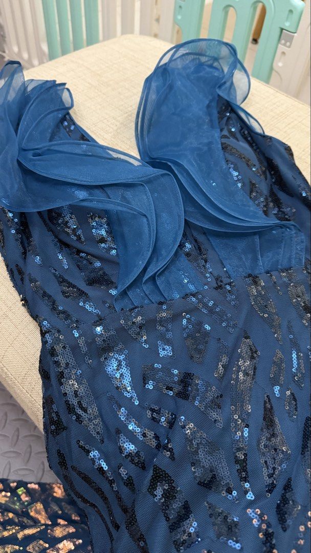 Navy Blue Sequin Ruffle V-Neck Evening Dress (Category: Evening dresses & gowns) located in Manila. Submitted by arbiecg (Listing ID 1462833343, Image 3). Description: - Navy blue maxi dress - All-over sequin embellishments - Flattering V-neckline - Chic ruffled short sleeves - Fitted silhouette - Elegant mermaid hem - Ideal for formal events, parties, and special occasions - Comfortable and eye-catching design.