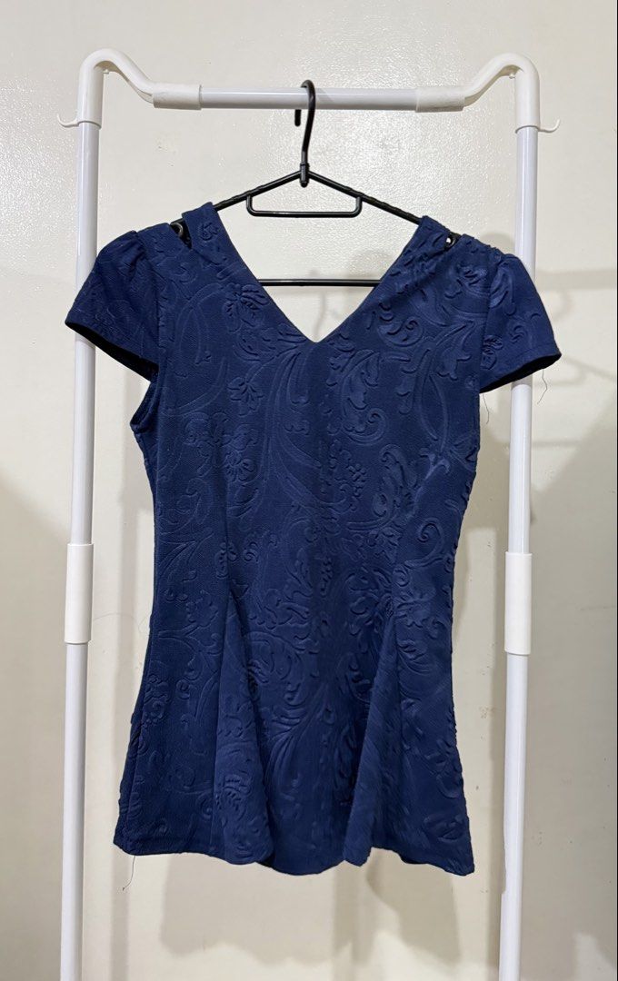 Navy Blue Textured Peplum Top with V-Neck (Category: Sleeveless) located in Manila. Submitted by lovedbyan (Listing ID 1462877751, Image 2). Description: -S-M - Navy blue peplum top - Textured floral pattern all over - V-neckline - Short sleeves - Flattering flared cut at the waist - Versatile for dressing up or down - Easy to pair with skirts or trousers.