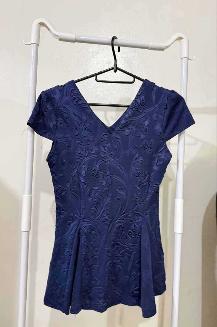 Navy Blue Textured Peplum Top with V-Neck (Category: Sleeveless) located in Manila. Submitted by lovedbyan (Listing ID 1462877751, Image 1). Description: -S-M - Navy blue peplum top - Textured floral pattern all over - V-neckline - Short sleeves - Flattering flared cut at the waist - Versatile for dressing up or down - Easy to pair with skirts or trousers.