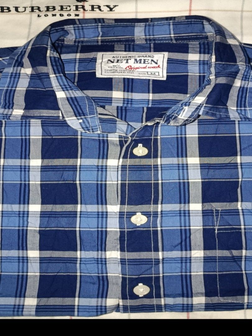 Net Men Blue Plaid Button-Up Shirt (Category: Tshirts & Polo Shirts ) located in Nabunturan. Submitted by marmitoren42236 (Listing ID 1462692719, Image 1). Description: - Authentic Net Men blue and white plaid shirt - Original wash - Button-up front with chest pocket - Size: Medium (M) - Ideal for casual outfits.