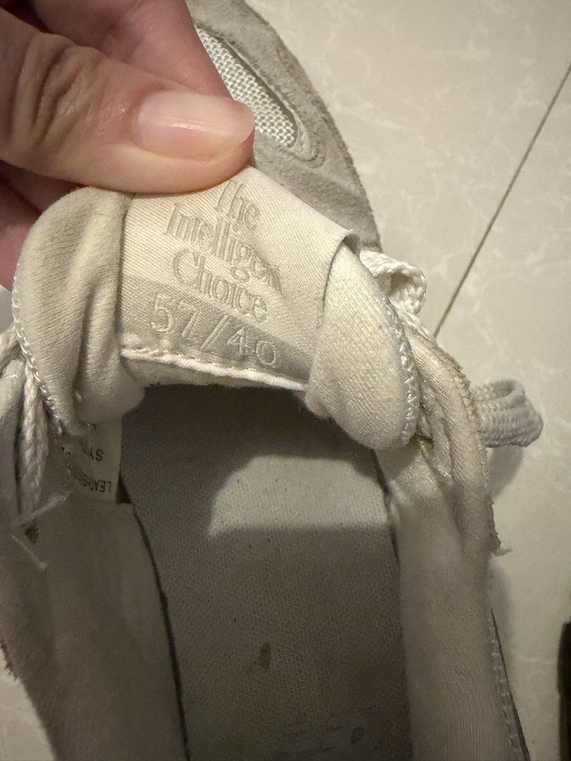 New Balance Sneakers Size 7 (Category: Sneakers) located in Las Pinas. Submitted by bibliomomma (Listing ID 1462776106, Image 2). Description: Selling this stylish pair of New Balance sneakers in a lovely beige and pink/coral colorway. While they still look good from above, please note that they have been worn and show visible signs of use. Specifically, there is prominent creasing, scuffing, and wear along the foam midsole of both shoes (refer t