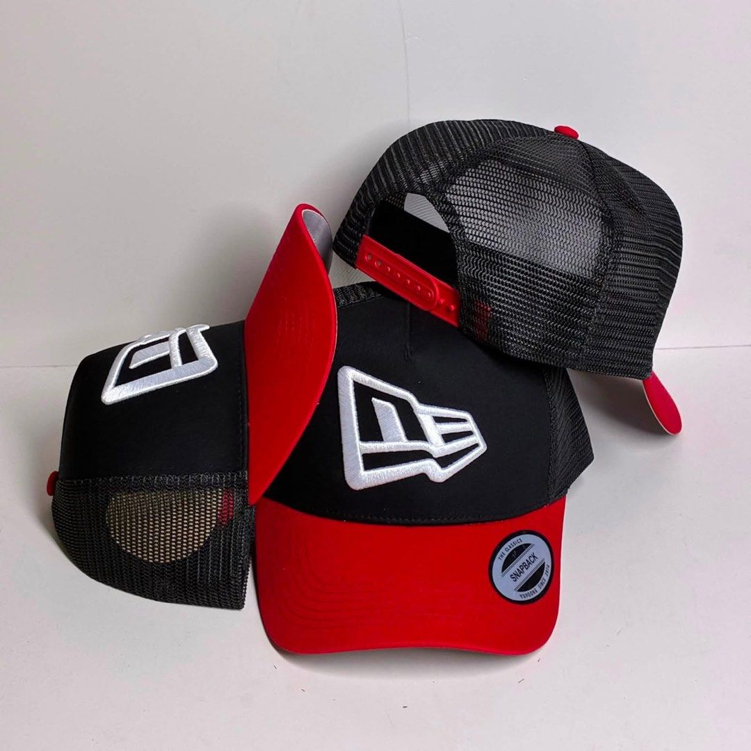 New Era 9FORTY A-Frame trucker (Category: Caps & Hats) located in Bacoor. Submitted by snapgame (Listing ID 1462705924, Image 1). Description: New Era 9FORTY A-Frame trucker snapback cap with a prominent white New Era flag logo embroidered on the front mesh and foam panel..