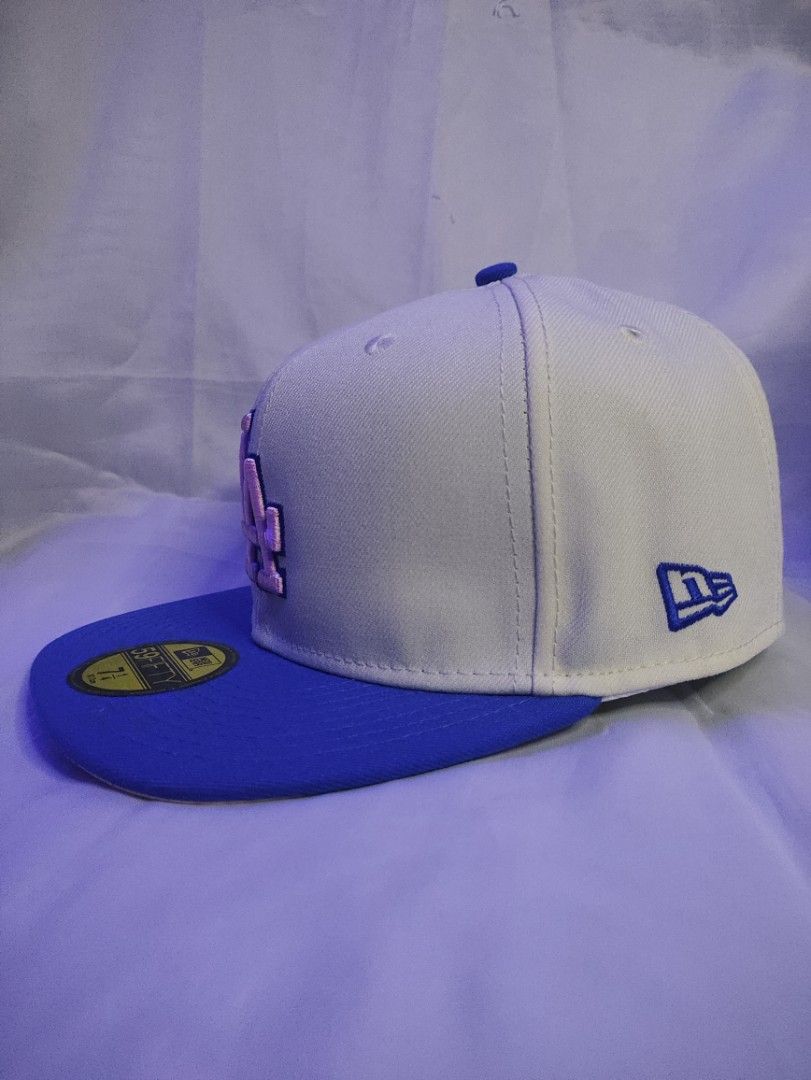 New Era LA Dodgers 59FIFTY Fitted Hat (Category: Caps & Hats) located in Manila. Submitted by vestige_collection (Listing ID 1462864143, Image 2). Description: - Brand: New Era - Model: 59FIFTY Fitted Hat - Team: LA Dodgers - Color: Cream crown with blue brim - Features: Iconic pink LA logo, side graphic, MLB logo on back - Size: 7 1/4.