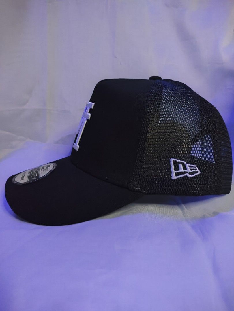 New Era LA Dodgers 9TWENTY Trucker Cap Black (Category: Caps & Hats) located in Manila. Submitted by vestige_collection (Listing ID 1462863644, Image 3). Description: - Black LA Dodgers trucker cap - New Era 9TWENTY adjustable fit - Breathable mesh back - Ideal for everyday or game days - Classic and stylish design.