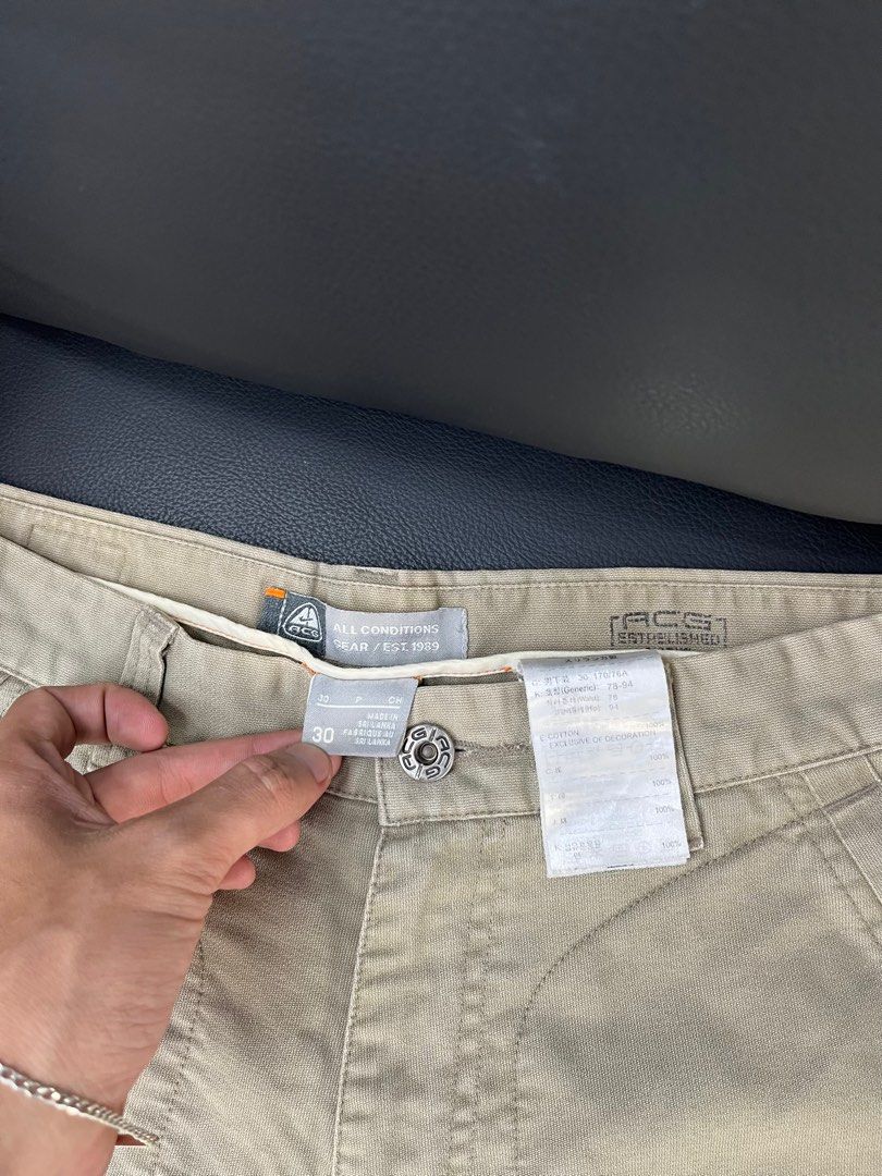 Nike ACG Cargo Shorts Size 30 Khaki (Category: Shorts) located in Caloocan City. Submitted by pumarenluc79160 (Listing ID 1462768412, Image 3). Description: - Nike ACG Khaki Cargo Shorts - Size: 30 waist - Established 1989 - Multiple pockets for ample storage - Durable material, ideal for outdoor activities like hiking - Comfortable fit for casual wear.