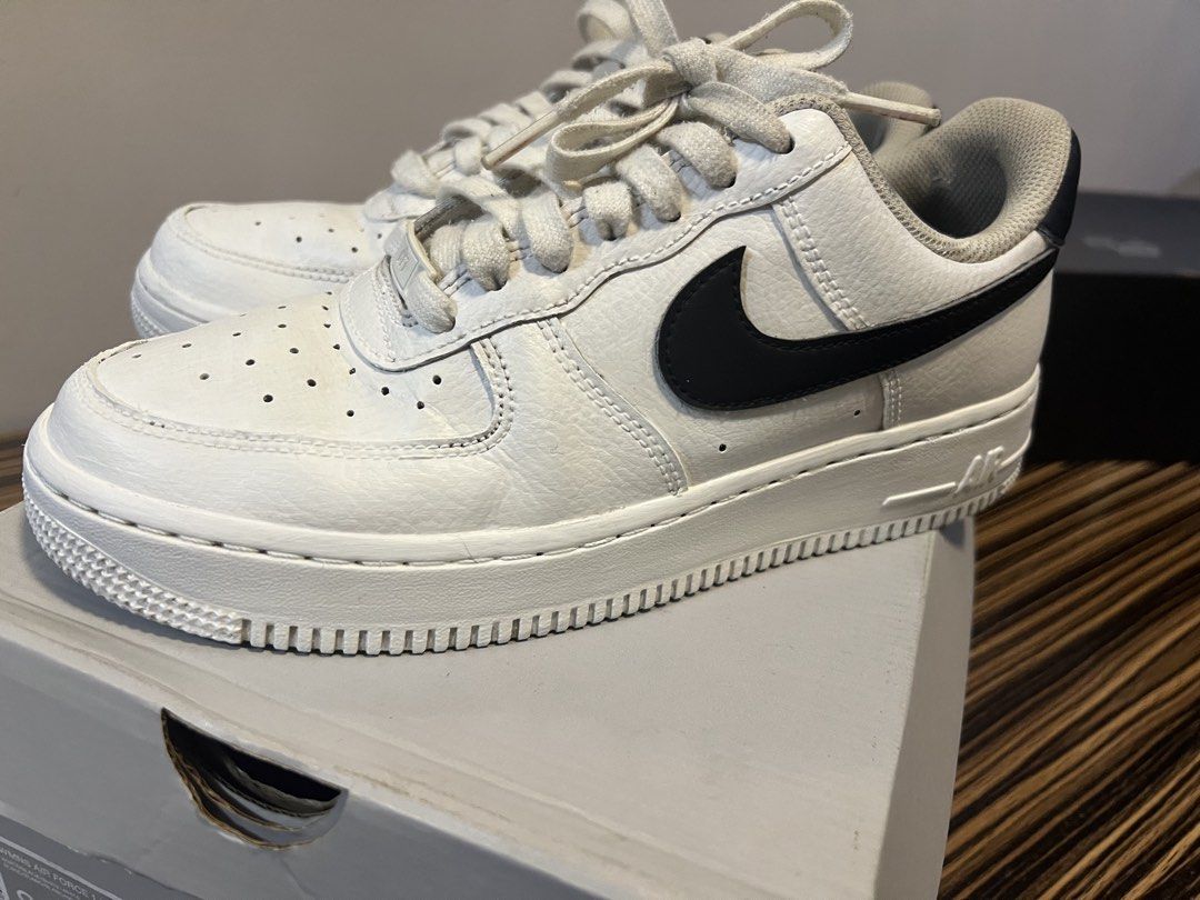 Nike Air Force 1 '07 White Black Sneakers (Category: Sneakers) located in Quezon City. Submitted by anna_rl23 (Listing ID 1462734294, Image 1). Description: - Classic white Nike Air Force 1 '07 sneakers - Features a black swoosh detail - Size: US Men's 8 / US Women's 9.5 - Includes original box.