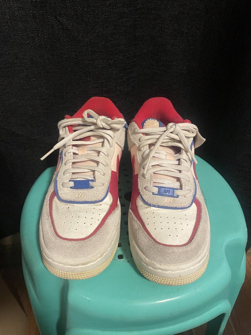 Nike Air Force 1 Shadow Red Blue White Suede (Category: Sneakers) located in San Jose. Submitted by vvcarmen (Listing ID 1462770195, Image 2). Description: - Nike Air Force 1 Shadow sneakers - Color: Grey suede with red and blue accents - Design: Classic Air Force 1 silhouette with a layered sole - Laces: White - Perfect for: Casual wear - Condition: Shows some signs of wear on the sole and suede -need cleaning lang Size: 6.5wmns.