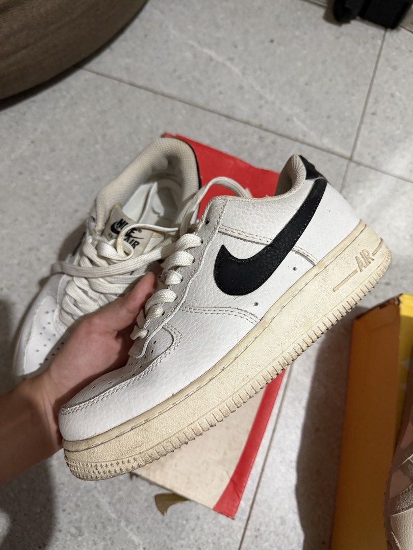 Nike Air Force 1 White Black Sneakers (Category: Sneakers) located in Caloocan City. Submitted by rohllee (Listing ID 1462716497, Image 1). Description: - Classic white Nike Air Force 1s - Black swoosh detail - Size: US 5.5 / 22.5cm - Signs of wear on soles and leather - Great for everyday wear - Selling as is.