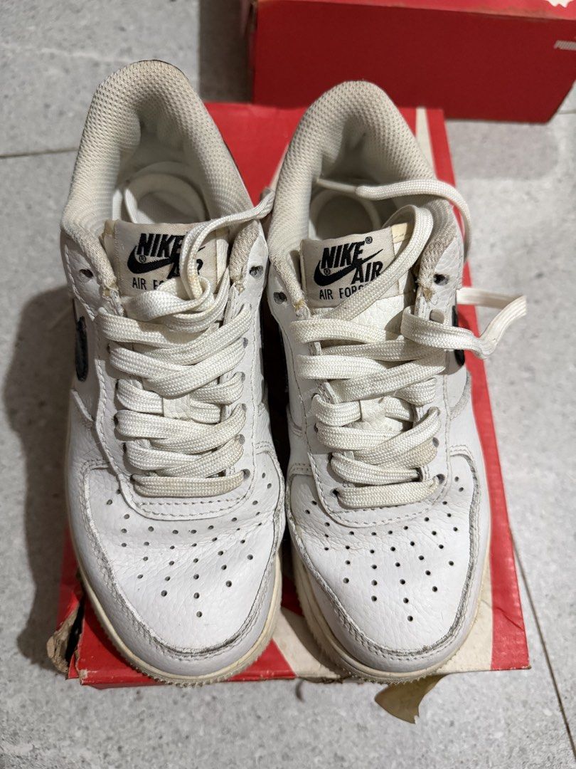 Nike Air Force 1 White Black Sneakers (Category: Sneakers) located in Caloocan City. Submitted by rohllee (Listing ID 1462716497, Image 2). Description: - Classic white Nike Air Force 1s - Black swoosh detail - Size: US 5.5 / 22.5cm - Signs of wear on soles and leather - Great for everyday wear - Selling as is.