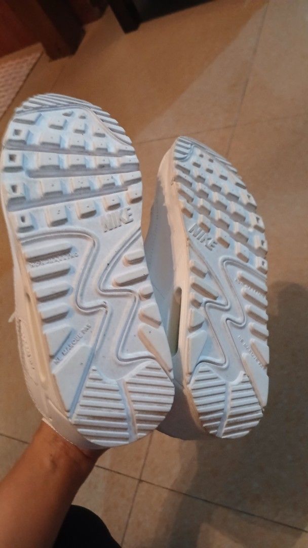 Nike Air Max 90 White Leather Sneakers (Category: Sneakers) located in Imus. Submitted by dahdahlicious (Listing ID 1462861085, Image 3). Description: - Classic white Nike Air Max 90s - triple white - Genuine leather upper - Responsive Air Max cushioning for all-day comfort - Durable soles with good tread remaining - Minor scuffs from normal wear, but plenty of life left - Perfect for everyday style and comfort.