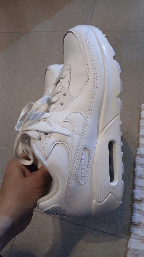 Nike Air Max 90 White Leather Sneakers (Category: Sneakers) located in Imus. Submitted by dahdahlicious (Listing ID 1462861085, Image 2). Description: - Classic white Nike Air Max 90s - triple white - Genuine leather upper - Responsive Air Max cushioning for all-day comfort - Durable soles with good tread remaining - Minor scuffs from normal wear, but plenty of life left - Perfect for everyday style and comfort.