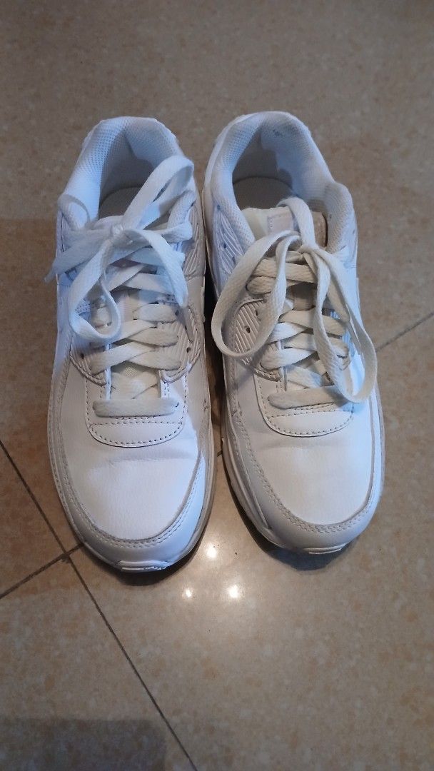 Nike Air Max 90 White Leather Sneakers (Category: Sneakers) located in Imus. Submitted by dahdahlicious (Listing ID 1462861085, Image 1). Description: - Classic white Nike Air Max 90s - triple white - Genuine leather upper - Responsive Air Max cushioning for all-day comfort - Durable soles with good tread remaining - Minor scuffs from normal wear, but plenty of life left - Perfect for everyday style and comfort.