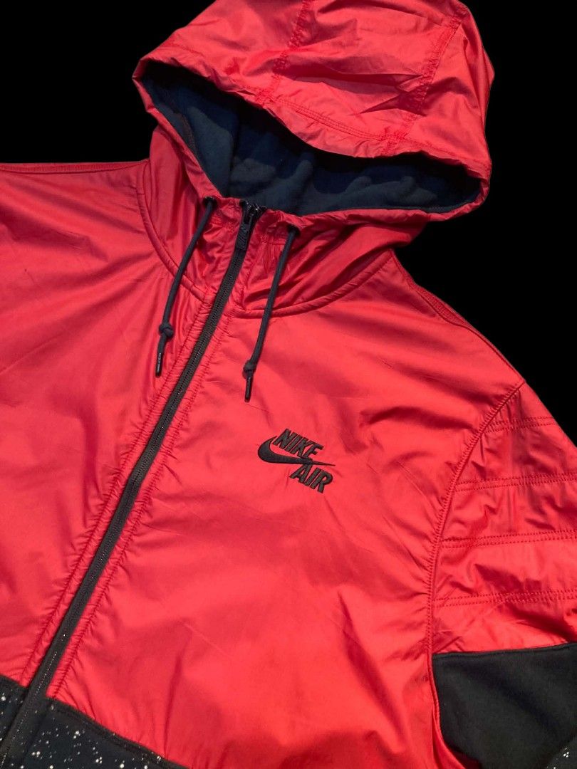 Nike Air Windbreaker Jacket Red Black Speckle (Category: Coats, Jackets and Outerwear) located in Trece Martires City. Submitted by djaothriftshop (Listing ID 1462838868, Image 3). Description: - Red and black Nike Air windbreaker jacket - Unique speckled pattern on sleeves and lower body - Zip-up front with a hood - Ideal for casual wear or light workouts - Size XL (fits 180-185cm) - Made in China.