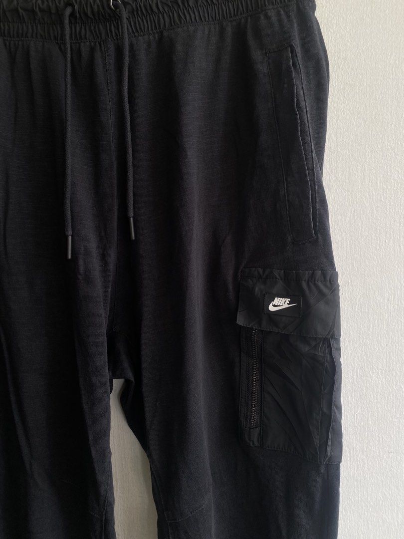 Nike Black Cargo Jogger Pants XL (Category: Joggers) located in Manila. Submitted by anthony1723 (Listing ID 1462779994, Image 2). Description: - Black Nike cargo jogger pants - Size XL - Elastic waistband with drawstring - Two side pockets - One right leg cargo pocket with zip closure - Material: 100% cotton (overlays: polyester/exclusive of decoration) - Perfect for casual wear.