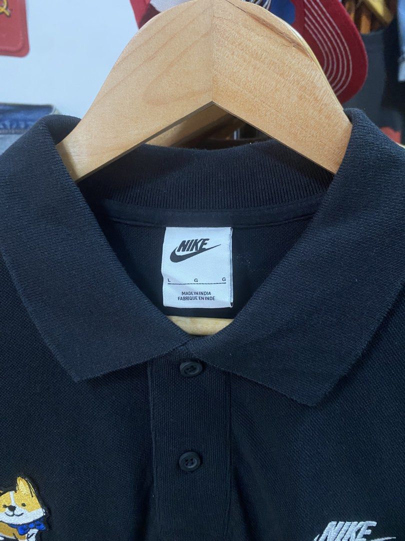 Nike Black Polo Shirt with Corgi Patch (Category: Tshirts & Polo Shirts ) located in Taguig. Submitted by jhayarpuen15676 (Listing ID 1462776750, Image 3). Description: - Black Nike polo shirt - Size G - Cute corgi patch on left chest - Embroidered Nike swoosh on right chest - Button-up collar - Made in India - Dimes 21.5x31.