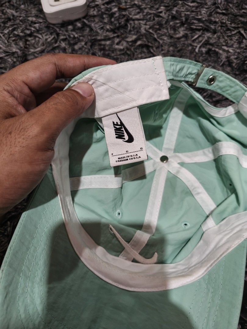 Nike Cap Mint Green (Category: Caps & Hats) located in Laguindingan. Submitted by jingsuu22 (Listing ID 1462806322, Image 3). Description: - Mint green Nike cap - Features the classic Nike swoosh logo - Adjustable strap for a customized fit - Simple and versatile design - Ideal for daily wear and matching various outfits.