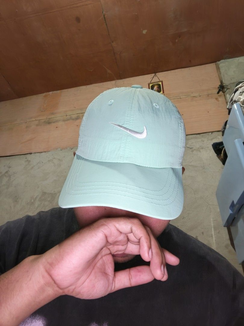 Nike Cap Mint Green (Category: Caps & Hats) located in Laguindingan. Submitted by jingsuu22 (Listing ID 1462806322, Image 2). Description: - Mint green Nike cap - Features the classic Nike swoosh logo - Adjustable strap for a customized fit - Simple and versatile design - Ideal for daily wear and matching various outfits.