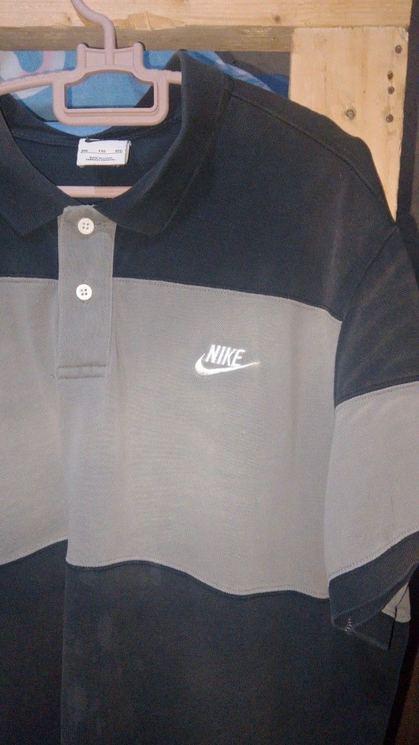 Nike Color Block Polo Shirt (Category: Tshirts & Polo Shirts ) located in Manila. Submitted by igoooorrrr (Listing ID 1462771423, Image 3). Description: - Grey and dark blue Nike polo shirt - Short sleeves with a two-button placket - Classic color block design - Perfect for casual wear or a sporty look - Xxl on tag but best fits is large/xl.