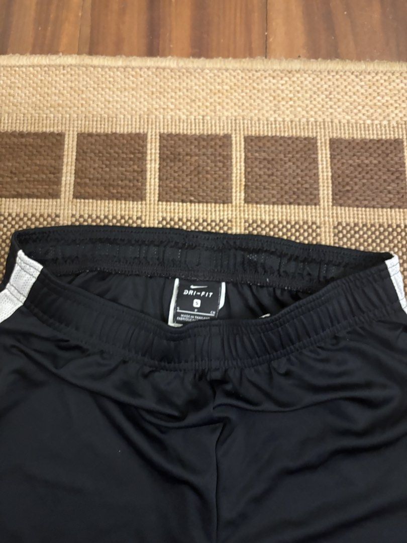 Nike Dri-FIT Black Athletic Shorts (Category: Shorts) located in Paranaque City. Submitted by max_bully014 (Listing ID 1462865105, Image 2). Description: - Black Nike Dri-FIT shorts - Iconic Nike swoosh logo on right leg - White mesh paneling on sides for breathability - Comfortable elastic waistband with adjustable drawstring - Versatile: Ideal for sports, workouts, or everyday casual wear - Made with breathable, sweat-wicking Dri-FIT material -