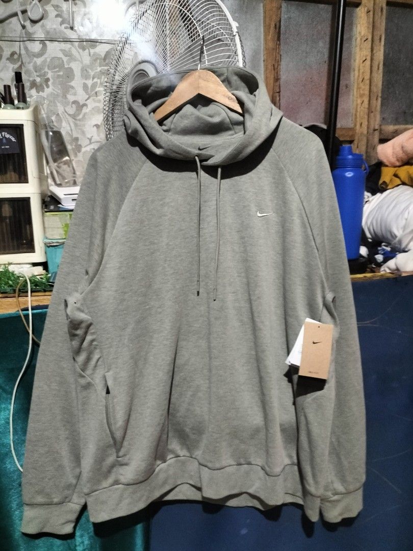 Nike Dri-Fit Grey Hoodie (Category: Hoodies) located in Valencia. Submitted by cabisaythriftshop (Listing ID 1462856493, Image 2). Description: - Grey Nike Dri-Fit Hoodie - Size: XL - Features: Small embroidered swoosh logo on chest, raglan sleeves, drawstring hood, kangaroo pocket - Material: Dri-Fit fabric for sweat-wicking comfort - Origin: Made in Vietnam.