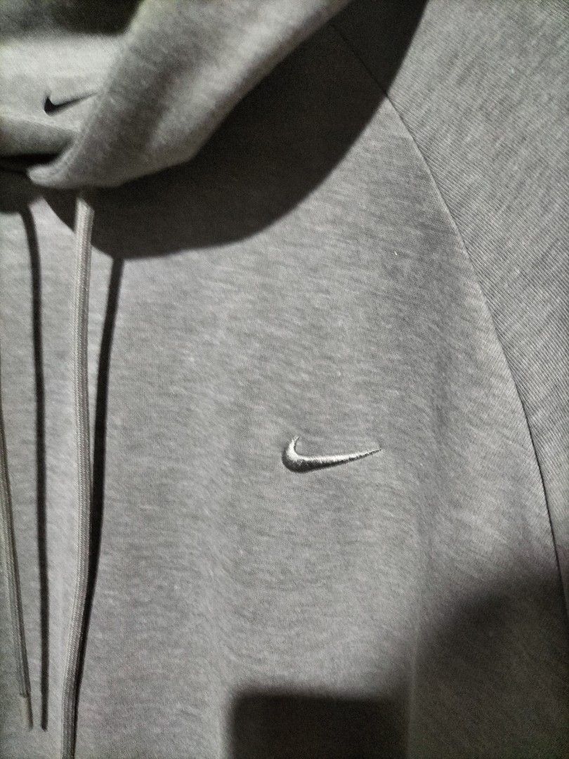 Nike Dri-Fit Grey Hoodie (Category: Hoodies) located in Valencia. Submitted by cabisaythriftshop (Listing ID 1462856493, Image 3). Description: - Grey Nike Dri-Fit Hoodie - Size: XL - Features: Small embroidered swoosh logo on chest, raglan sleeves, drawstring hood, kangaroo pocket - Material: Dri-Fit fabric for sweat-wicking comfort - Origin: Made in Vietnam.